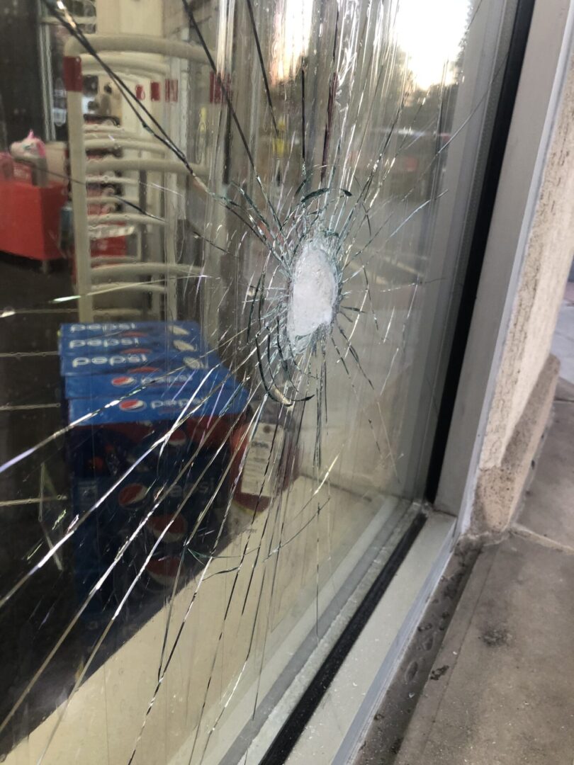 Broken Glass Door of a Shop